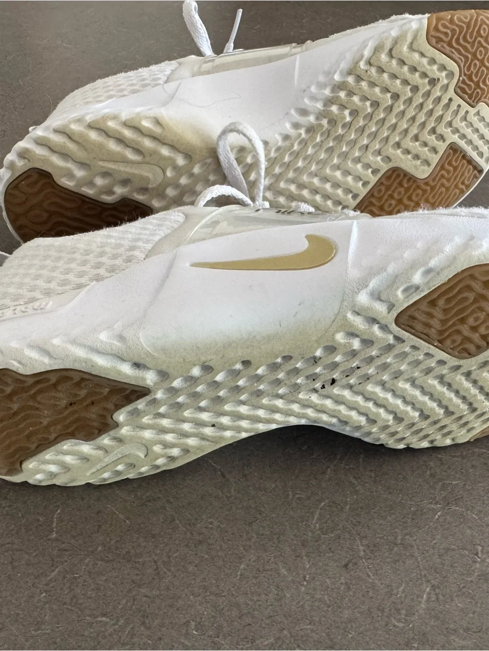 Nike White Sneakers with Gold Accents